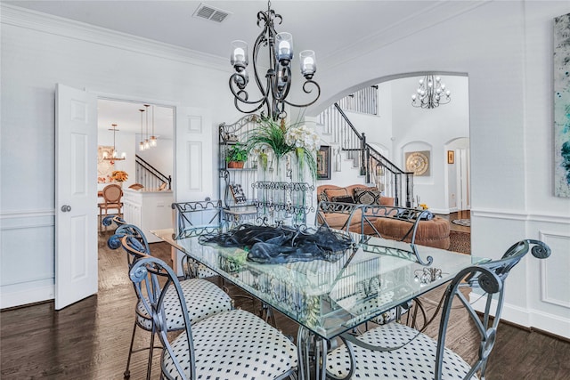 dining room with ornamental molding and dark wood-type flooring