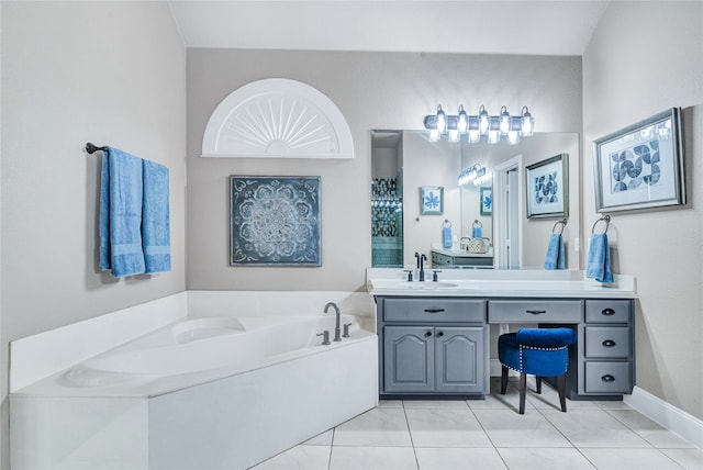 bathroom featuring vanity, tile patterned floors, and a bathing tub