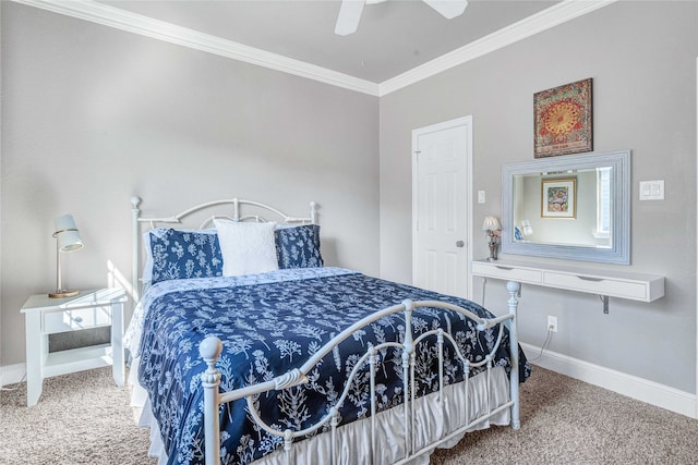 carpeted bedroom with ceiling fan and ornamental molding