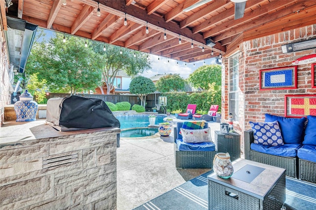 view of patio / terrace featuring outdoor lounge area, ceiling fan, exterior kitchen, area for grilling, and an in ground hot tub