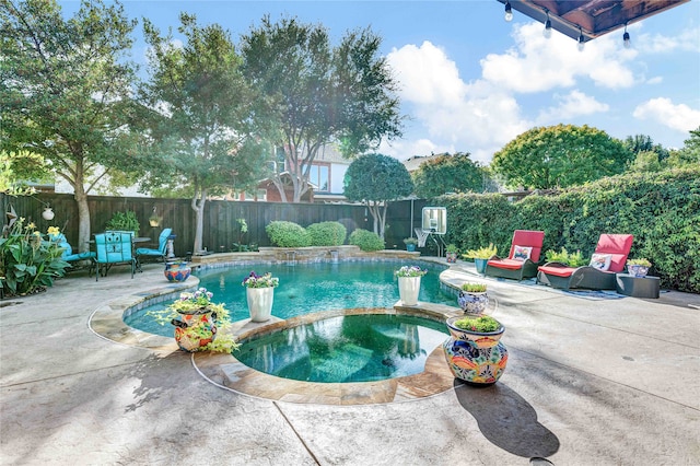 view of swimming pool featuring an in ground hot tub and a patio