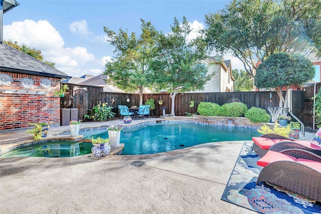 view of pool featuring an in ground hot tub and a patio