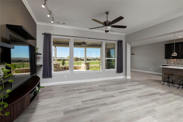 living room with light hardwood / wood-style floors, ceiling fan, and ornamental molding