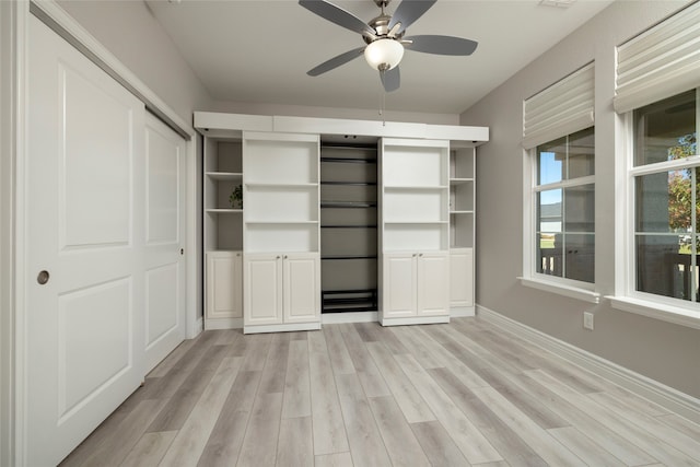 unfurnished bedroom featuring ceiling fan, a closet, and light hardwood / wood-style floors