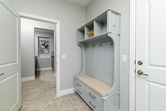 mudroom with light tile patterned floors