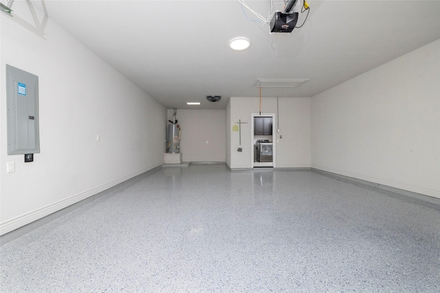 garage featuring electric panel, a garage door opener, and water heater