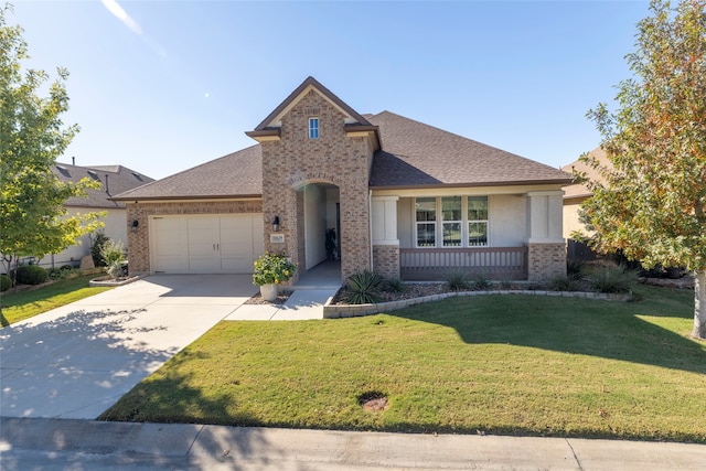 view of front of property with a garage and a front lawn