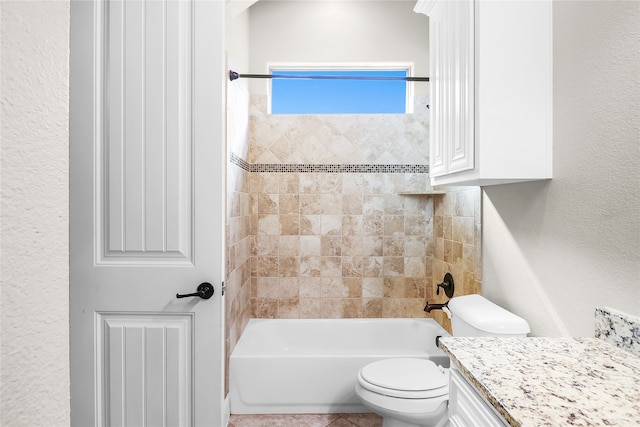 full bathroom with vanity, toilet, and tiled shower / bath combo