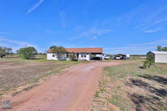 ranch-style house featuring a carport