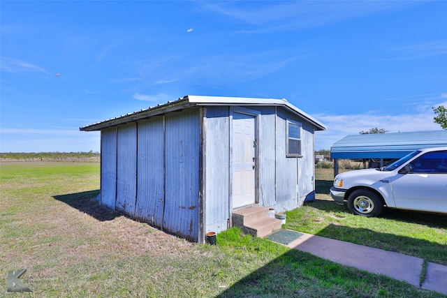 view of outdoor structure with a lawn