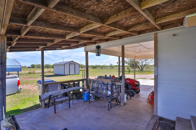 view of patio featuring a storage unit