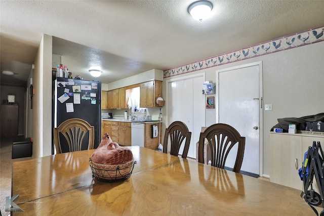 dining area with a textured ceiling