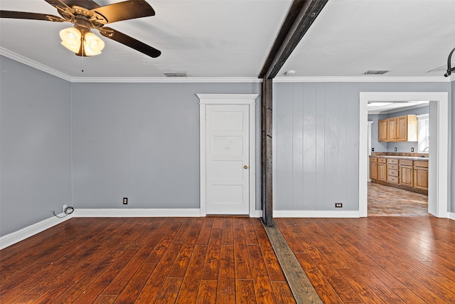 spare room with hardwood / wood-style flooring, ornamental molding, and ceiling fan