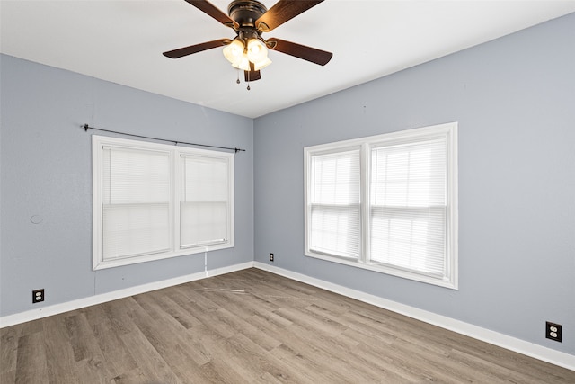 spare room with ceiling fan and light hardwood / wood-style flooring