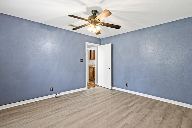 unfurnished room with light hardwood / wood-style floors and ceiling fan