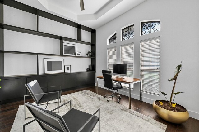 bedroom with dark wood-type flooring, connected bathroom, and ceiling fan