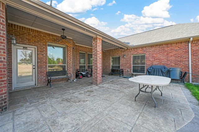 view of patio / terrace with ceiling fan and a grill