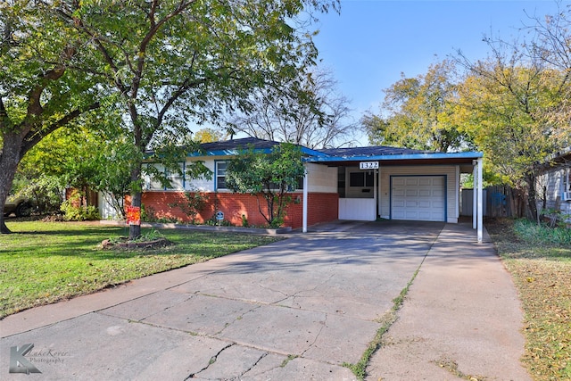 ranch-style home with a front yard and a garage