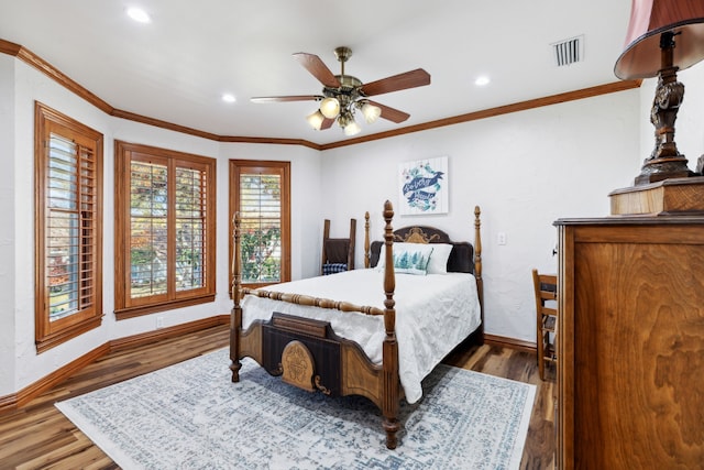 bedroom with ceiling fan, hardwood / wood-style floors, and ornamental molding