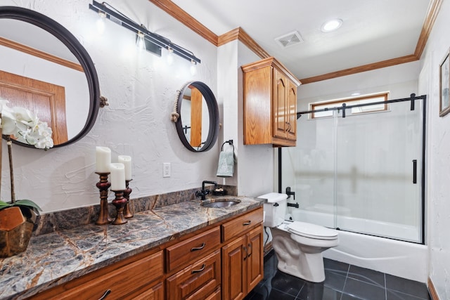 full bathroom featuring tile patterned floors, ornamental molding, bath / shower combo with glass door, vanity, and toilet