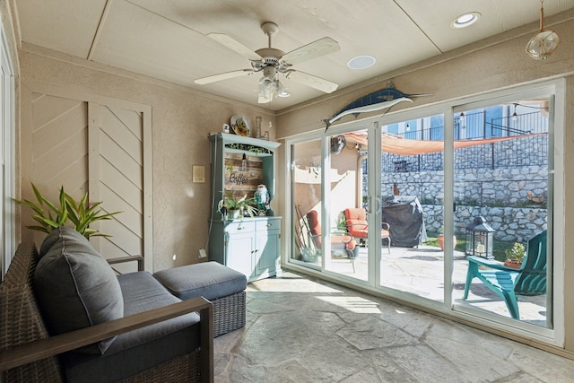 sitting room featuring ceiling fan