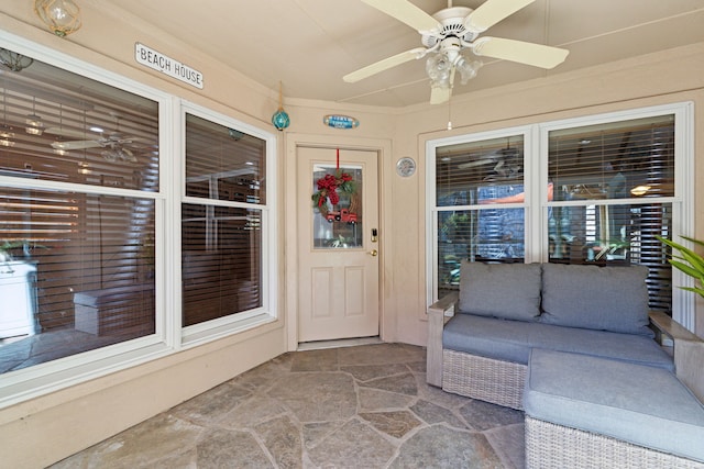 property entrance with ceiling fan