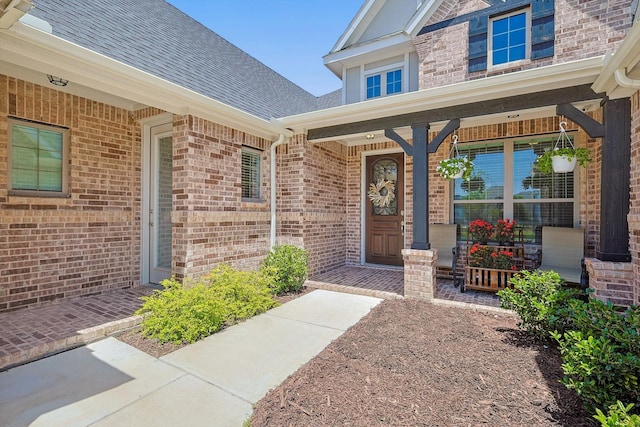 property entrance featuring covered porch