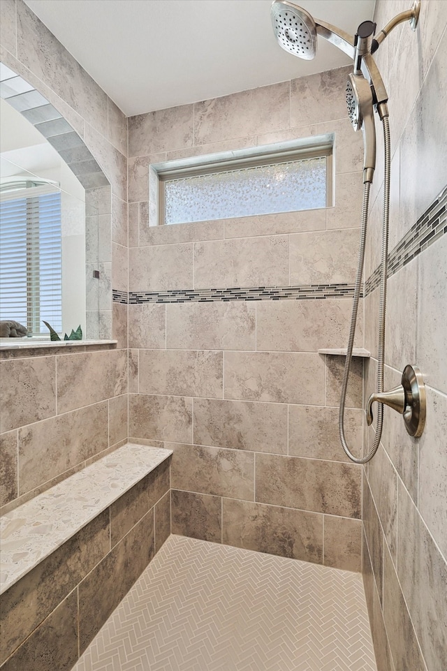 bathroom featuring tiled shower