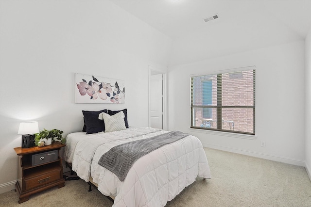 bedroom featuring light carpet