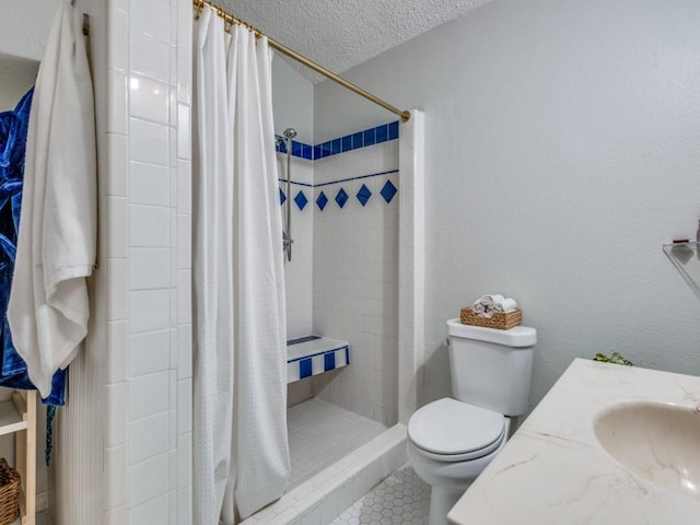 bathroom with tile patterned flooring, vanity, toilet, a textured ceiling, and a shower with shower curtain