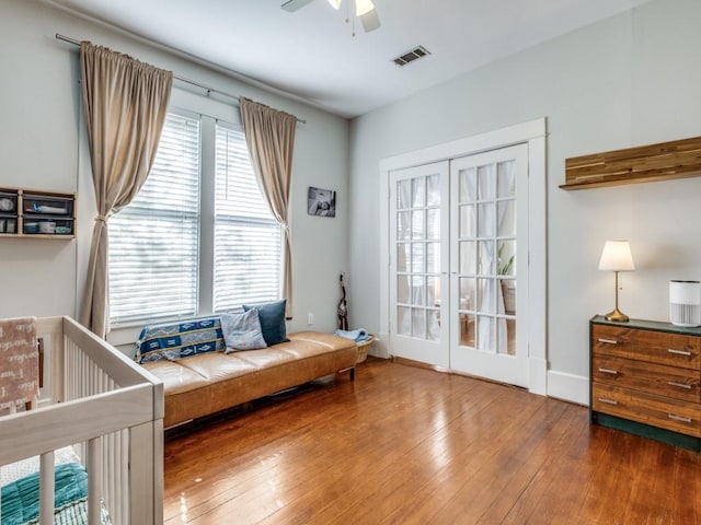 interior space featuring wood-type flooring and ceiling fan