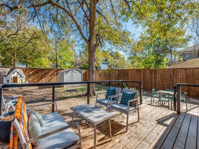 wooden deck with a storage shed