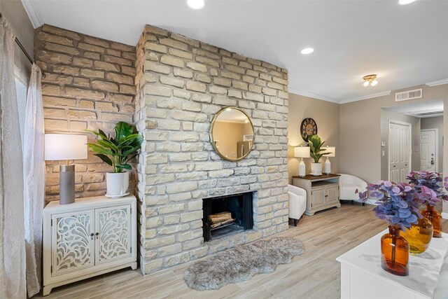 kitchen with kitchen peninsula, light stone counters, stainless steel appliances, sink, and white cabinets