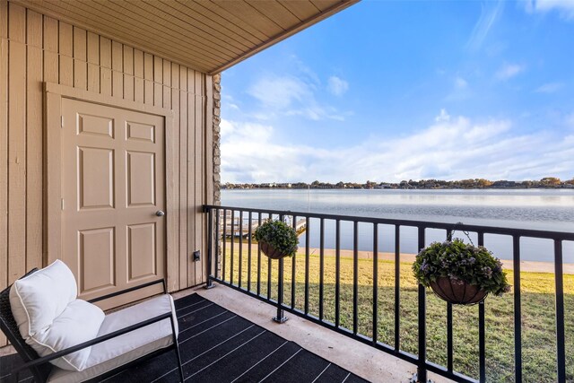 balcony featuring a water view