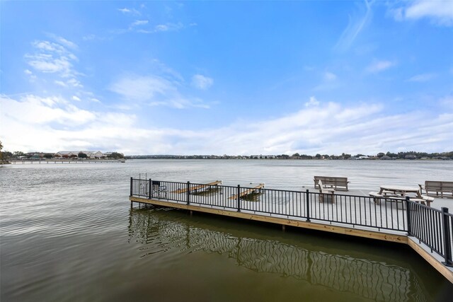 bird's eye view featuring a water view and a view of the beach