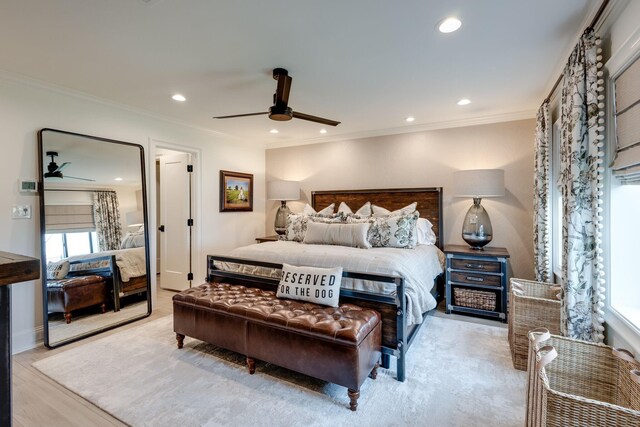 bedroom featuring vaulted ceiling with beams, ceiling fan, and light wood-type flooring