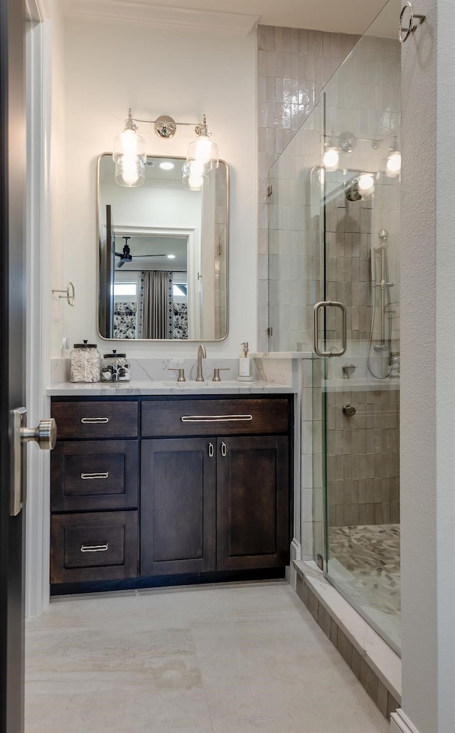 bathroom with walk in shower and vanity