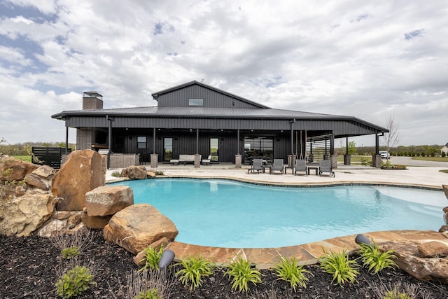 view of swimming pool with a patio area