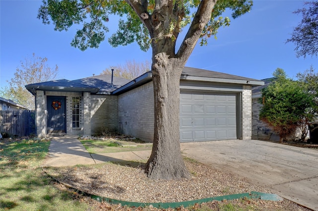 ranch-style home featuring a garage