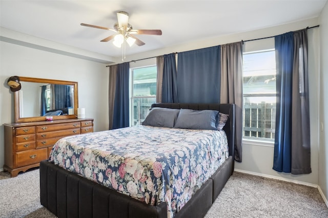 bedroom featuring ceiling fan and carpet