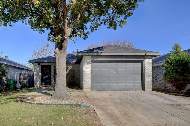 ranch-style home featuring a garage