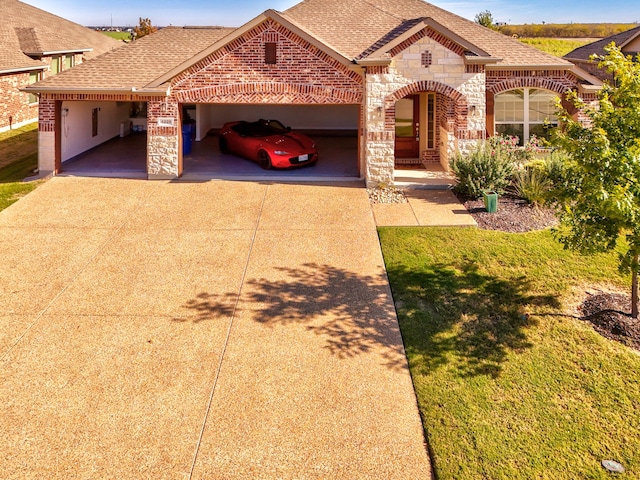 view of front of house featuring a garage and a front lawn