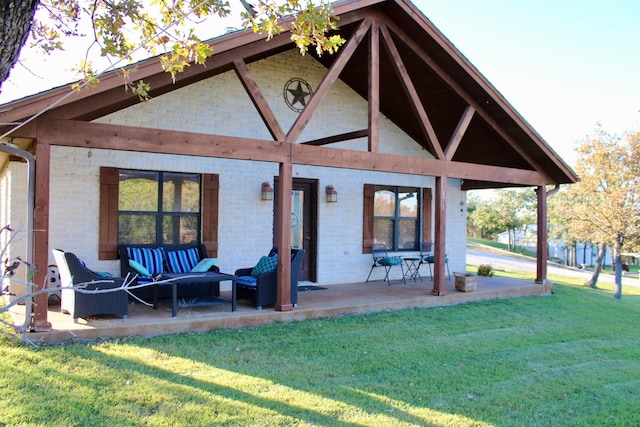 rear view of house featuring a lawn and an outdoor living space