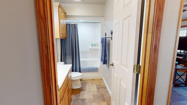 full bathroom featuring shower / tub combo, vanity, and toilet