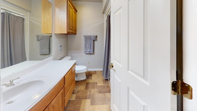 bathroom with vanity and toilet