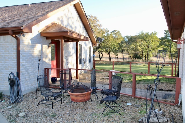 view of patio / terrace with a fire pit