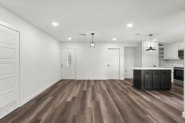 unfurnished living room featuring dark wood-type flooring