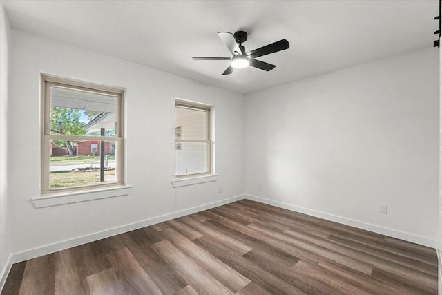 unfurnished room featuring dark hardwood / wood-style flooring and ceiling fan