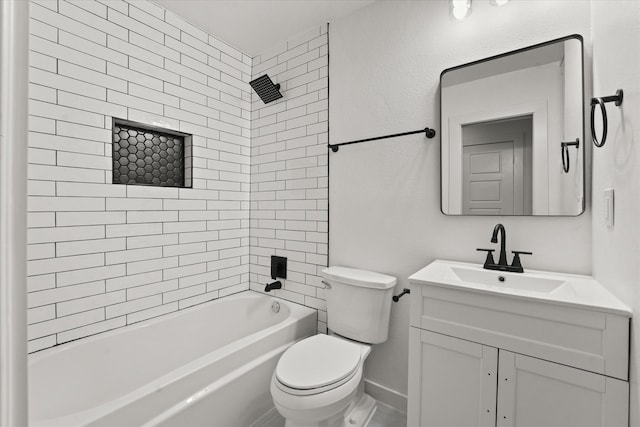 full bathroom with tiled shower / bath, vanity, and toilet