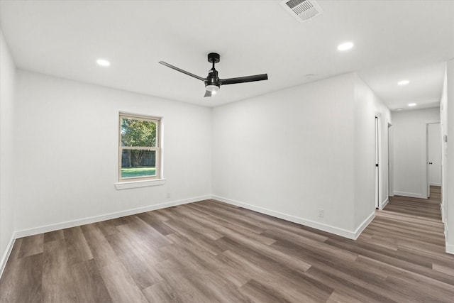 empty room with wood-type flooring and ceiling fan